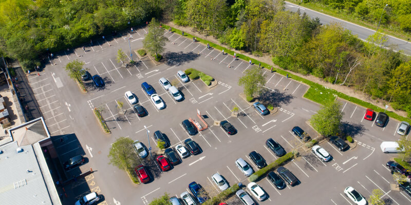 Aerial view of a cars parked in a car park
